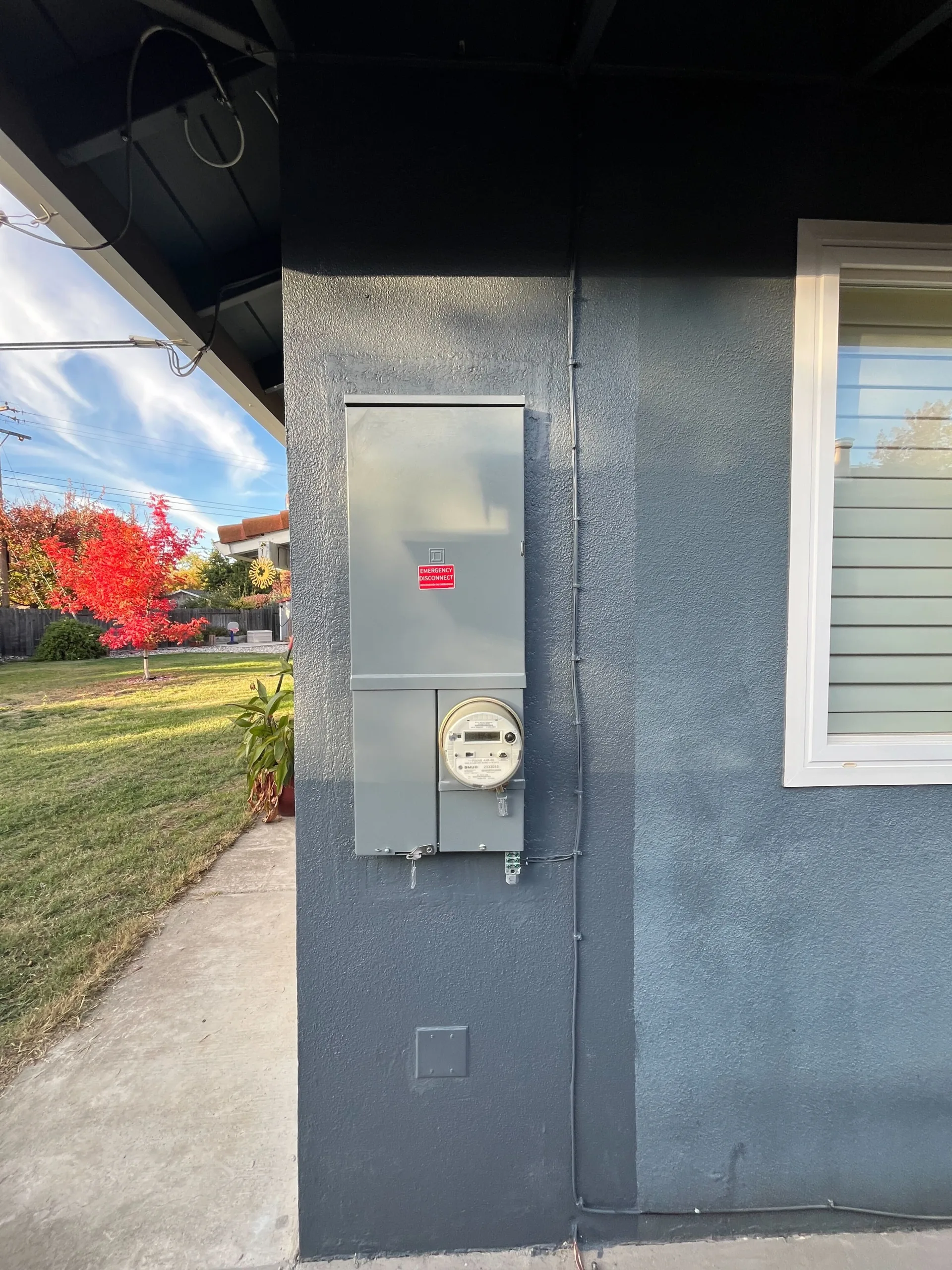Modern electrical fuse box on a Sacramento home exterior wall